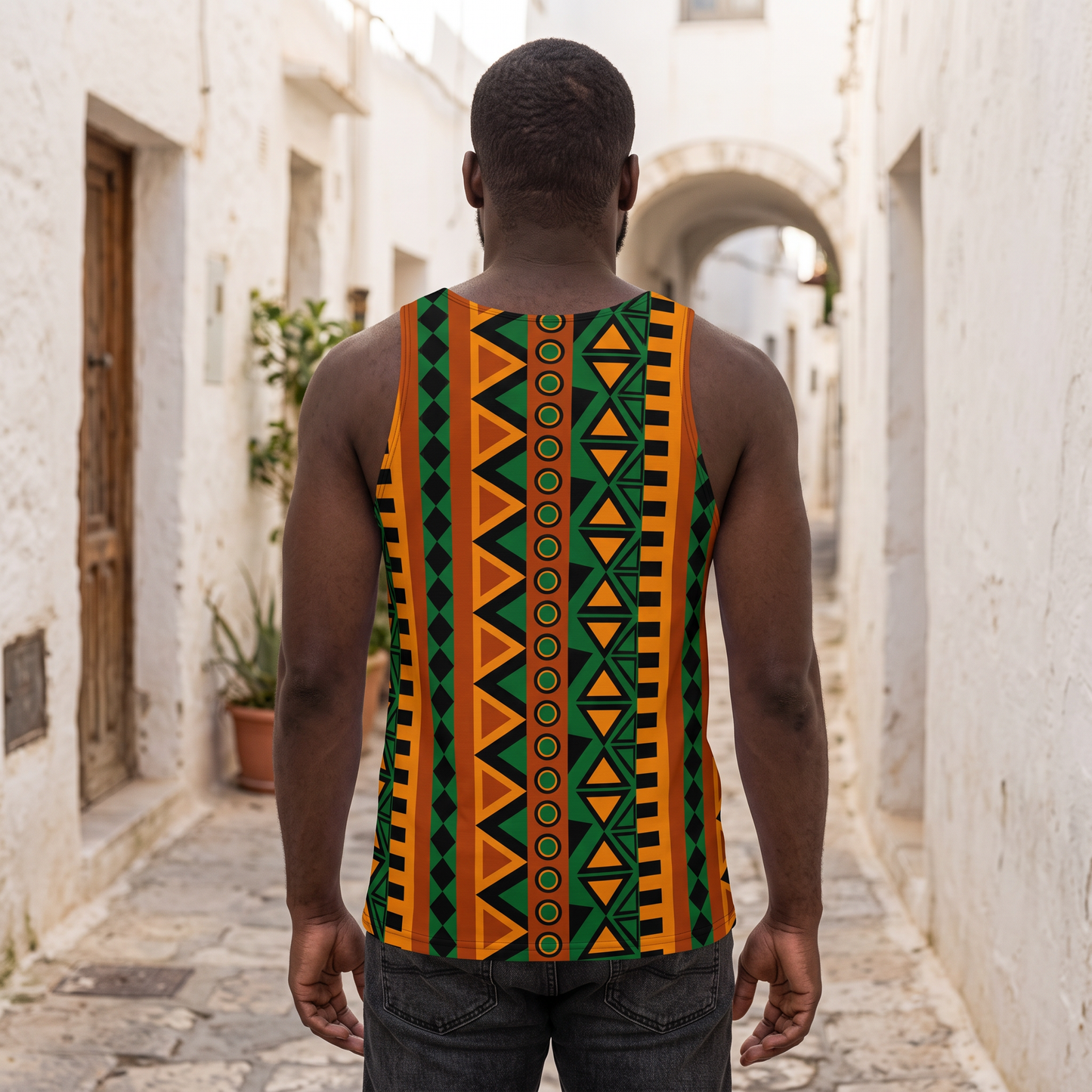 Back view of the Mzansi Unisex Tank Top in a whitewashed alley